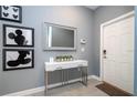 Bright entryway with console table and Mickey Mouse art at 4837 Dedication St, Kissimmee, FL 34746