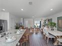 Open concept kitchen with island and stainless steel appliances at 2738 Flushing Dr, Apopka, FL 32703