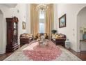 Elegant living room with high ceilings and ornate rug at 9011 Pinnacle Cir, Windermere, FL 34786