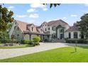 Grand estate home with manicured lawn at 9011 Pinnacle Cir, Windermere, FL 34786