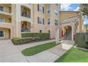 Building exterior with walkway and green bushes at 8815 Worldquest Blvd # 2201, Orlando, FL 32821