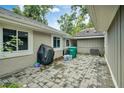 Brick paved patio with grill and storage space at 701 Castlewood Dr, Winter Springs, FL 32708