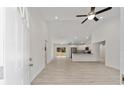 Bright and airy living room with vinyl flooring and open kitchen at 7743 Sw 146Th Lane Rd, Ocala, FL 34473