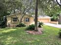 Landscaped yard and front of house view at 425 E Hillcrest St, Altamonte Springs, FL 32701