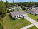 One-story house with driveway and large yard at 781 Marion Oaks Trl, Ocala, FL 34473