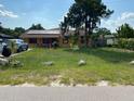 House with solar panels and a large yard at 709 N Disston, Tavares, FL 32778