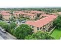 Condo community featuring multiple buildings and ample parking at 901 Charo Pkwy # 732, Davenport, FL 33897