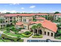 Luxury condo community with resort-style amenities and lush landscaping at 901 Charo Pkwy # 732, Davenport, FL 33897