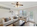 Bright living room with comfy seating and coastal decor at 901 Charo Pkwy # 732, Davenport, FL 33897