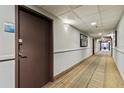Building hallway with carpeted floor and neutral wall color at 6165 Carrier Dr # 1206, Orlando, FL 32819