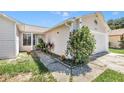 View of house from the side with landscaping at 5920 Norvale Ct, Orlando, FL 32808