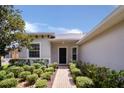 Front view of a single-story house with a walkway at 316 Shelbourne Loop, Kissimmee, FL 34759