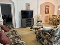 Living room with sofa, coffee table and fireplace at 346 Kildrummy Dr, Davenport, FL 33896