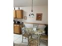 Kitchen with breakfast nook and wood cabinets at 346 Kildrummy Dr, Davenport, FL 33896