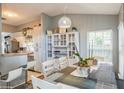 Charming dining area with white table and cabinetry, and a kitchen view at 1707 Terra Cota Ct, Orlando, FL 32825