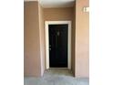 Modern condo front door with black finish and white trim at 6413 Astor Village Ave # 303, Orlando, FL 32835