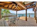 Covered dock with seating area and lake view at 279 Rippling Ln, Winter Park, FL 32789