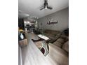 Open living room with modern decor and kitchen view at 4000 Santa Maria Dr # 105, Kissimmee, FL 34741