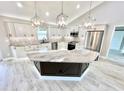 Modern kitchen with a large island, stainless steel appliances, and ample cabinetry at 6425 Sw 180Th Cir, Dunnellon, FL 34432