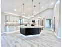 Modern kitchen with a large island, stainless steel appliances, and ample cabinetry at 6425 Sw 180Th Cir, Dunnellon, FL 34432
