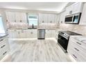Modern kitchen with stainless steel appliances and ample cabinetry at 6425 Sw 180Th Cir, Dunnellon, FL 34432