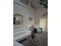 Bright living room with white sofas, glass coffee table, and decorative accents at 2909 Clubview # 2909, Orlando, FL 32822