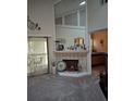 Living room fireplace with decorative accents and a large mirror at 2909 Clubview # 2909, Orlando, FL 32822