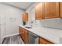 Modern kitchen with white countertops and oak wood cabinets at 8105 Coconut Palm Way # 203, Kissimmee, FL 34747