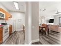 Open kitchen with light wood cabinets and modern appliances at 8105 Coconut Palm Way # 203, Kissimmee, FL 34747