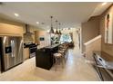 Modern kitchen with island and stainless steel appliances at 3219 Brasilia Ave, Kissimmee, FL 34747