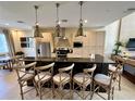 Modern kitchen with stainless steel appliances and an island with seating at 3219 Brasilia Ave, Kissimmee, FL 34747
