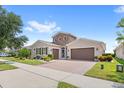 Two-story home with two car garage and curb appeal at 290 Silver Maple Rd, Groveland, FL 34736