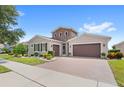 Two-story home with two car garage and curb appeal at 290 Silver Maple Rd, Groveland, FL 34736