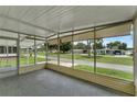 Peaceful screened porch overlooking the community at 411 Palo Verde Dr, Leesburg, FL 34748