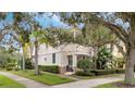 View of the house from the street, highlighting landscaping and architectural details at 11886 Nautica Dr, Orlando, FL 32827