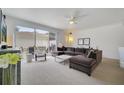 Spacious living room with a large sectional sofa and access to a patio at 11886 Nautica Dr, Orlando, FL 32827