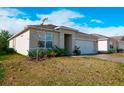 Exterior view of a single-Gathering home with a spacious front yard at 2836 Sunridge Loop, Saint Cloud, FL 34771