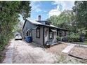 Gray house exterior with a side yard at 1079 Marion St, Lake Helen, FL 32744