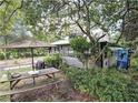 Relaxing backyard with a picnic table at 1079 Marion St, Lake Helen, FL 32744