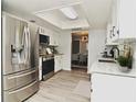 Modern kitchen with stainless steel appliances at 213 E Hillcrest St, Altamonte Springs, FL 32701