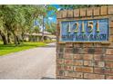 Home Again Ranch entrance with brick pillars at 12151 Walker Pond Rd, Winter Garden, FL 34787