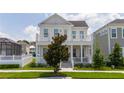 Two-story house with white columns and balcony at 7410 Barrier Cove Way, Kissimmee, FL 34747