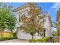 Modern home with stone accents and two-car garage at 837 Desert Mountain Ct, Reunion, FL 34747