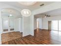 Bright dining room with a wood table and modern chandelier at 4901 Culdesac Ct, St Cloud, FL 34772