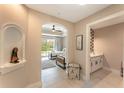 A hallway with access to a bedroom and a small bathroom at 7509 Seven Eagles Way, Reunion, FL 34747
