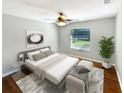 Bedroom with a king-size bed and hardwood floors at 110 Lindenwood Ln, Kissimmee, FL 34743