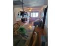 Dining area with a glass-top table and wicker chairs at 2301 S Atlantic Ave # 327, Daytona Beach, FL 32118