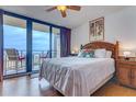 Ocean view bedroom with a king bed and sliding doors to a balcony at 2301 S Atlantic Ave # 327, Daytona Beach, FL 32118