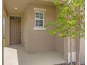 Inviting front porch with a brown door and neutral colored walls at 957 King Parc Rd, Orange City, FL 32763