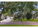 Home with a brick driveway and lush landscaping at 731 Midget Dr, Winter Park, FL 32789